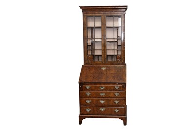 Lot 100 - A GEORGE II AND LATER FIGURED WALNUT BUREAU BOOKCASE OF NARROW PROPORTIONS