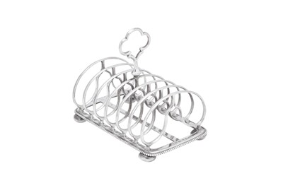 Lot 409 - A Victorian sterling silver seven bar toast rack, Birmingham 1874 by Elkington and Co