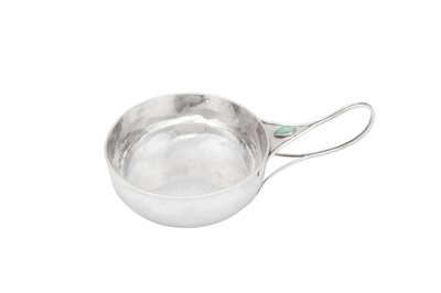 Lot 332 - An Edwardian ‘Arts and Crafts’ sterling silver butter dish, London 1905, designed by Charles Robert Ashbee for the Guild of Handicrafts