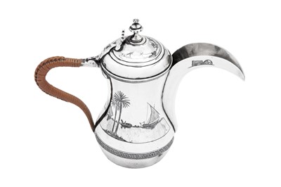Lot 186 - An early 20th century Iraqi silver and niello Dallah coffee pot, Omara circa 1927-29, signed Abdul Jabbar