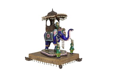 Lot 244 - AN INDIAN POLYCHROME-ENAMELLED ELEPHANT HOWDAH FIGURINE