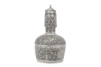 Lot 366 - A RETICULATED AND PIERCED SILVER GLASS BOTTLE