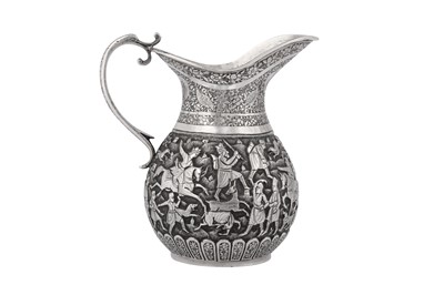 Lot 363 - A SMALL REPOUSSÉ SILVER JUG