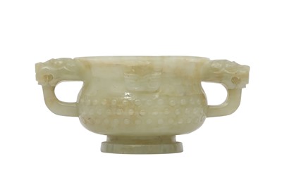 Lot 19 - A CHINESE PALE CELADON JADE ARCHAISTIC CUP.
