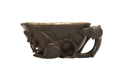 Lot 333 - A CHINESE HARDWOOD 'PEACHES' LIBATION CUP.