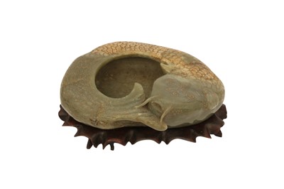 Lot 534 - A CHINESE PALE CELADON JADE 'FISH' BRUSH WASHER.