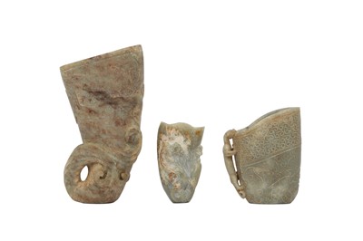 Lot 511 - THREE CHINESE PALE CELADON JADE ARCHAISTIC RHYTONS.