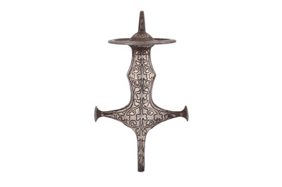 Lot 529 - AN INDIAN SILVER-INLAID STEEL TULWAR SWORD HILT