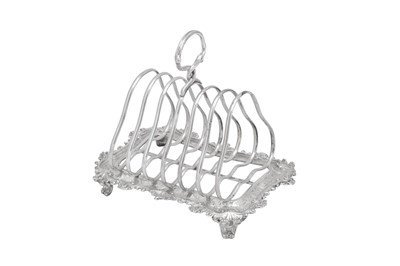 Lot 408 - A Victorian sterling silver “Teniers” seven bar toast rack, London 1860 by John Samuel Hunt