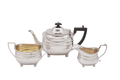 Lot 373 - A George V sterling silver three-piece tea service, London 1922 by J W Benson Ltd