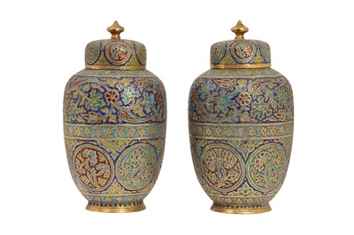 Lot 582 - A PAIR OF KASHMIRI GILT-COPPER POLYCHROME CHAMPLEVÉ ENAMELLED URNS