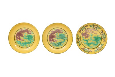 Lot 129 - THREE CHINESE YELLOW-GROUND 'DRAGON' DISHES.