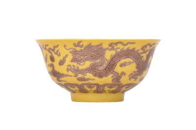 Lot 609 - A CHINESE YELLOW-GROUND 'DRAGON' BOWL.