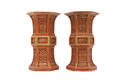 Lot 105 - A PAIR OF CHINESE GILT-DECORATED CORAL-RED HEXAGONAL-SECTION VASES, GU.