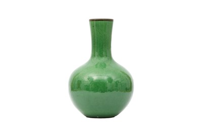 Lot 544 - A CHINESE APPLE GREEN-GLAZED BOTTLE VASE