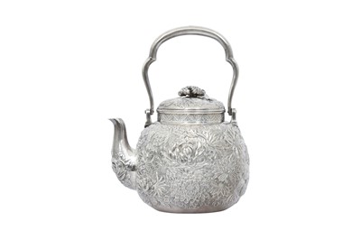Lot 480 - A JAPANESE REPOUSSÉ SILVER 'CHRYSANTHEMUM' TEAPOT AND COVER.