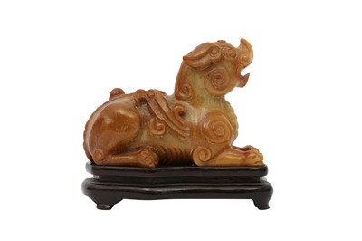 Lot 708 - A CHINESE SOAPSTONE ARCHAISTIC 'MYTHICAL BEAST' CARVING.