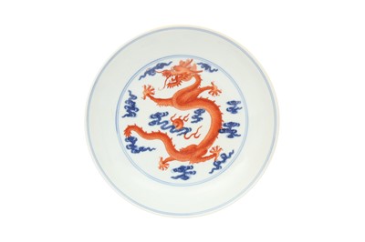 Lot 247 - A CHINESE BLUE AND WHITE AND IRON-RED 'DRAGON' DISH.