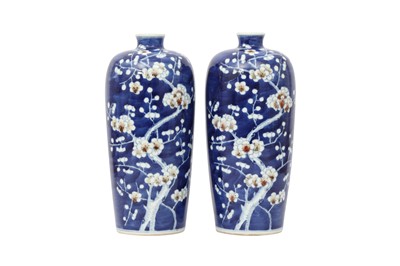 Lot 277 - A PAIR OF BLUE AND WHITE AND UNDERGLAZE RED 'PRUNUS' VASES.