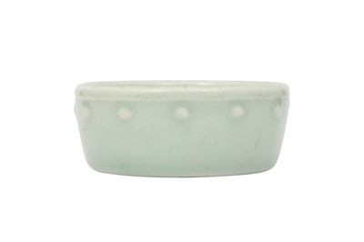 Lot 551 - A CHINESE CELADON-GLAZED WASHER.