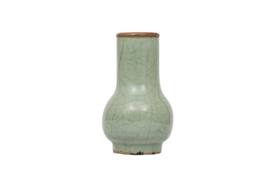 Lot 26 - A CHINESE CELADON-GLAZED BOTTLE VASE.