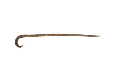 Lot 725 - λ A RHINOCEROS HORN WALKING STICK WITH IVORY SECTIONS.