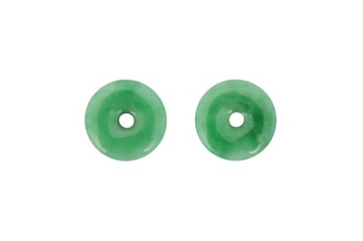 Lot 191 - A PAIR OF SMALL CHINESE APPLE-GREEN JADEITE PENDANTS.