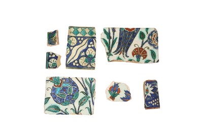 Lot 339 - SEVEN IZNIK POTTERY TILE FRAGMENTS