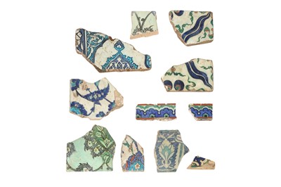 Lot 338 - ELEVEN IZNIK POTTERY TILE FRAGMENTS