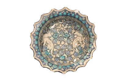 Lot 214 - AN ILKHANID FOOTED POTTERY BOWL DEPICTING TWO FOXES
