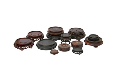 Lot 591 - A COLLECTION OF CHINESE WOOD STANDS AND COVERS.