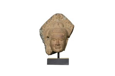 Lot 202 - A KHMER CARVED BUFF SANDSTONE HEAD OF LOKESHVARA