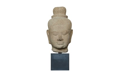 Lot 201 - A KHMER CARVED BUFF SANDSTONE HEAD OF THE HINDU GOD SHIVA
