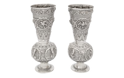 Lot 227 - A PAIR OF CEREMONIAL REPOUSSÉ SILVER MINIATURE VASES