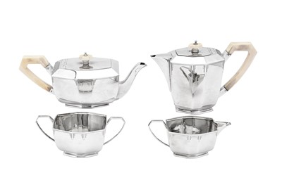 Lot 377 - A George V Art Deco sterling silver four-piece tea and coffee service, Sheffield 1935 by E Viner