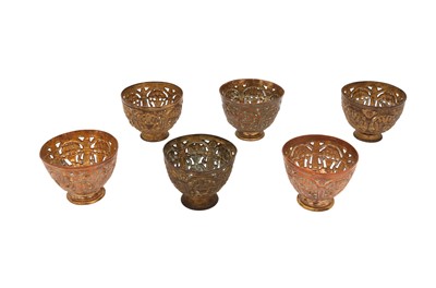 Lot 560 - A SET OF SIX OPENWORK TOMBAC ZARFS