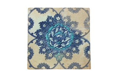 Lot 321 - A BLUE AND WHITE IZNIK POTTERY TILE WITH LOTUS SCROLLS