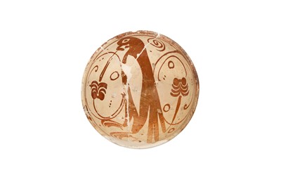 Lot 348 - AN EARLY HISPANO-MORESQUE COPPER LUSTRE-PAINTED POTTERY BOWL WITH BIRD MOTIF