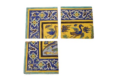 Lot 414 - THREE SAFAVID CUERDA SECA POTTERY TILES WITH ANIMALS