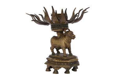 Lot 271 - A RITUAL BRASS CANDLE HOLDER WITH NANDI THE BULL