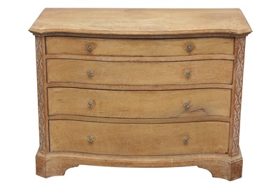 Lot 188 - AN ARTS AND CRAFTS STYLE LIMED OAK SERPENTINE CHEST OF DRAWERS