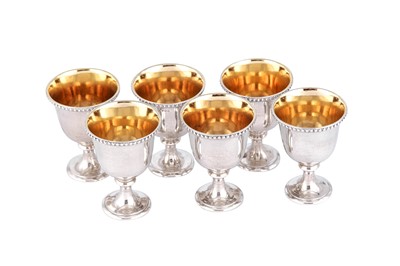 Lot 411 - A set of six Victorian sterling silver egg cups, London 1866 by Hunt and Roskell