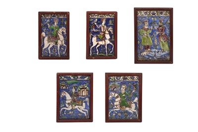 Lot 597 - FIVE QAJAR MOULDED FIGURAL POTTERY TILES