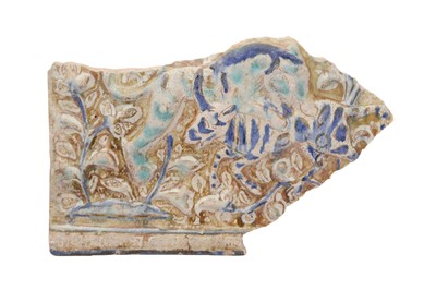Lot 15 - AN ILKHANID COBALT BLUE AND COPPER LUSTRE-PAINTED POTTERY TILE FRAGMENT