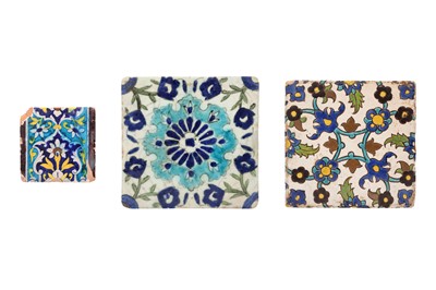 Lot 55 - THREE DECORATIVE ARCHITECTURAL POTTERY TILES WITH FLORAL MOTIFS