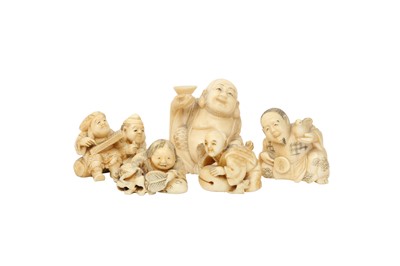 Lot 712 - λ FOUR JAPANESE IVORY NETSUKE AND AN IVORY OKIMONO.