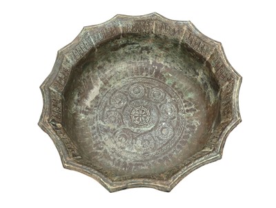 Lot 209 - A LARGE KHORASAN BRASS BASIN WITH KUFIC INSCRIPTIONS