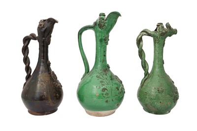 Lot 343 - THREE ÇANAKKALE POTTERY EWERS