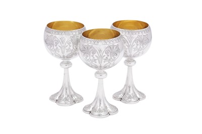 Lot 421 - A set of three Victorian sterling silver wine goblets, Birmingham 1875-76 by Elkington and Co