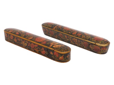 Lot 58 - TWO LACQUERED PAPIER-MÂCHÉ PEN CASES (QALAMDAN) WITH THE GOL-O-BOLBOL MOTIF